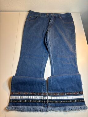 Andrew's Blues blue cotton jeans with embroidered floral trim and fringe
